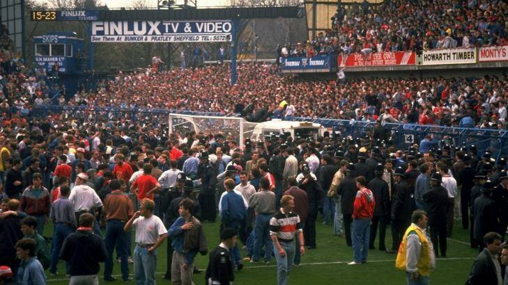 Tragedy: Supporters are crushed against the barrier at Hillsborough Stadium. Photo: David Cannon