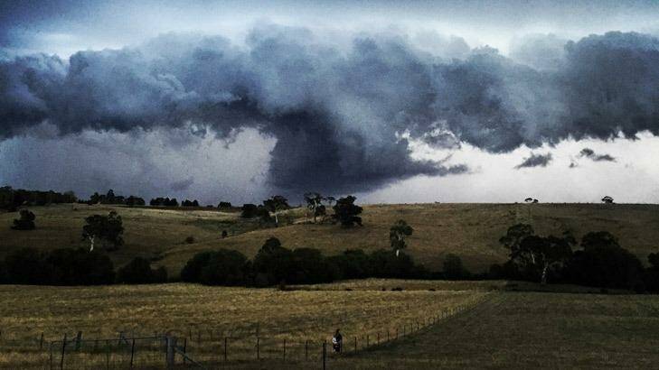 Storm clouds hang over a property near Daylesford. Photo: Nicky Catley