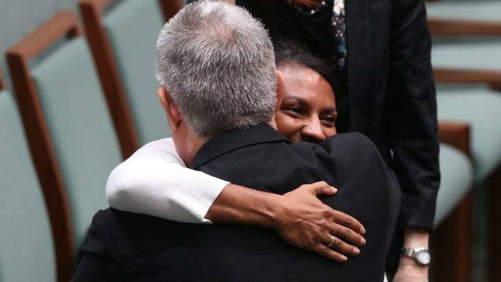 Liberal MP and committee chairman Ken Wyatt embraced by Labor senator and deputy chair Nova Peris after he tabled the committee's report on constitutional recognition of Aboriginal and Torres Strait Islander Peoples. Photo: Andrew Meares