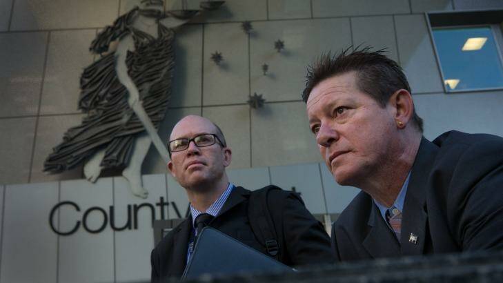 Franc Titan (right) and detective senior Constable Craig Jarvis, who helped Mr Titan bring David Whitcroft to justice Photo: Jason South