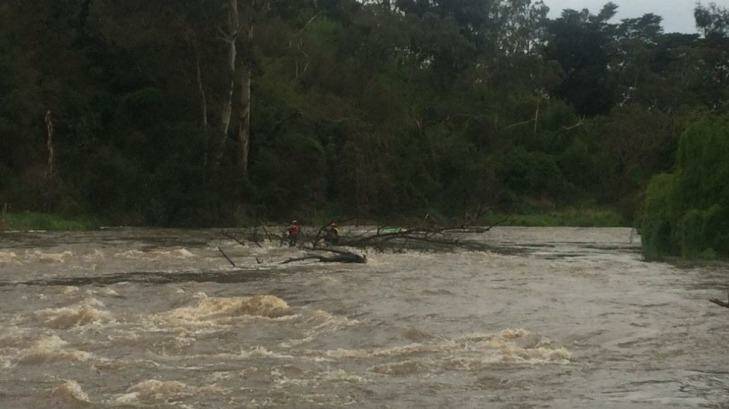 Two women stranded in the Yarra River at Warrandyte after their kayak capsized.  Photo: Courtesy Channel 7