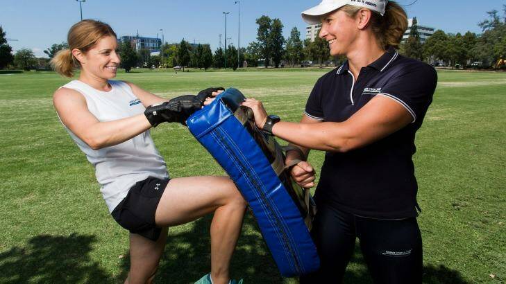 Personal trainer Jo Gray (right) with her client Sophie Eustace exercising at Orrong Park in Prahran.  Photo: Paul Jeffers