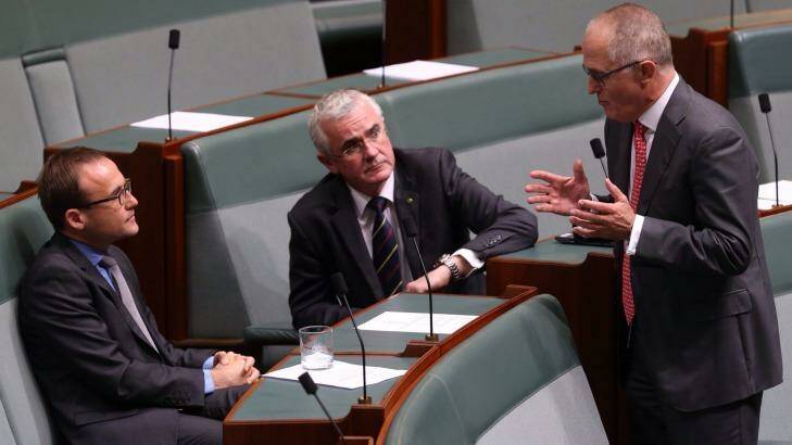 Communications Minister Malcolm Turnbull talks with crossbenchers Adam Bandt and Andrew Wilkie. Photo: Andrew Meares