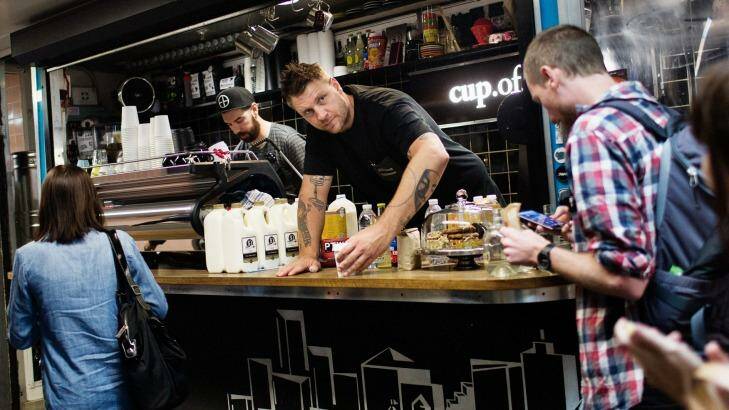 Baristas John 'The Textbook' Freeman, left, and Courtney 'The Architect' Patterson serve early morning coffee at Cup Of Truth coffee shop below Flinders Street in Melbourne. Photo: Paul Jeffers