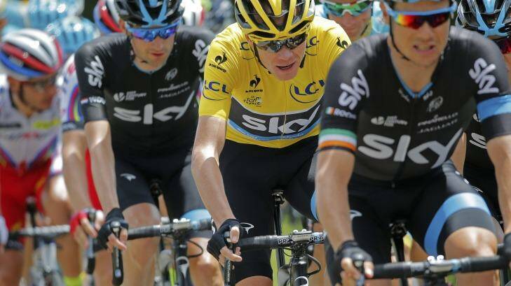 Britain's Christopher Froome, wearing the overall leader's yellow jersey, rides in the pack during the eighth stage of the Tour de France. Photo: Christophe Ena