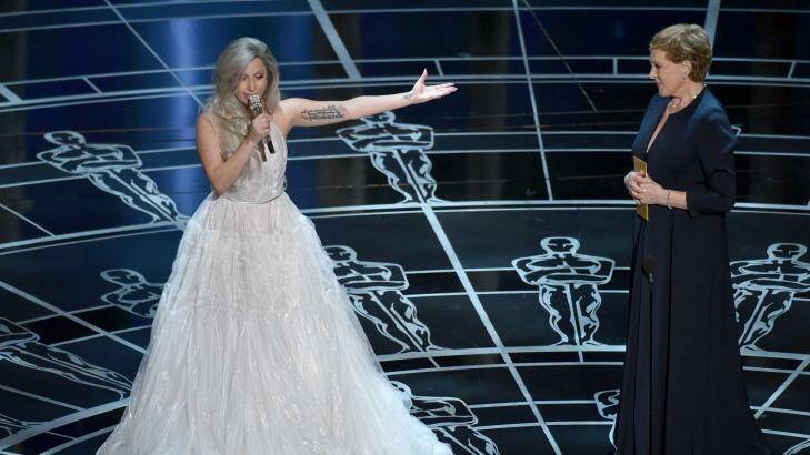 Lady Gaga, left, and Julie Andrews speak at the Oscars on Sunday, Feb. 22, 2015, at the Dolby Theatre in Los Angeles. (Photo by John Shearer/Invision/AP) Photo: John Shearer