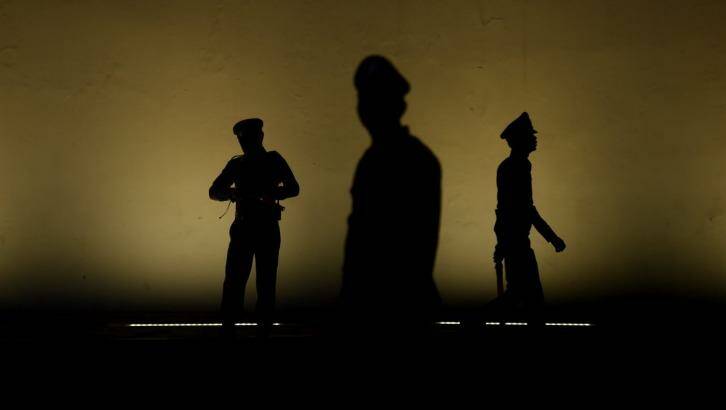 Officers guard The Grand Palace in Bangkok, on Monday. Photo: Kate Geraghty