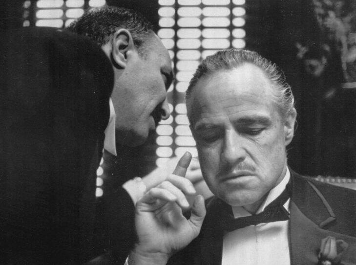 FILE--By tradition, the Godfather cannot refuse a request on his daughter's wedding day, and Bonasera, portrayed by Frank Puglia, asks Don Corleone, portrayed by Marlon Brando, at right, for a favor in this scene from the 1972 movie "The Godfather".  Best-selling author Mario Puzo, creator of the fictional Corleone mob family and winner of two Oscars for his screen adaptations of his book ``The Godfather,'' died Friday, July 2, 1999. He was 78. (AP Photo/Paramount Pictures,file)