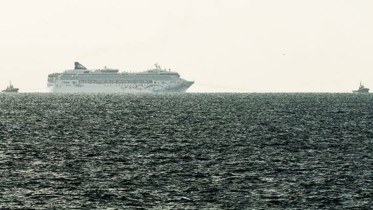 The Norwegian Star being towed back to Melbourne as seen from Mornington Pier on Saturday afternoon. Photo: Daniel Pockett