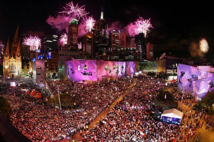 MELBOURNE, AUSTRALIA - DECEMBER 31:  People enjoying the celebrations at Federation Square during the New Year's Eve celebrations on December 31, 2016 in Melbourne, Australia.  (Photo by Daniel Pockett/Fairfax Media)