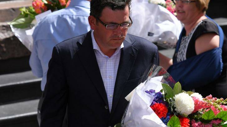 Premier Daniel Andrews lays flowers in the Bourke Street Mall on Saturday morning.  Photo: Eddie Jim