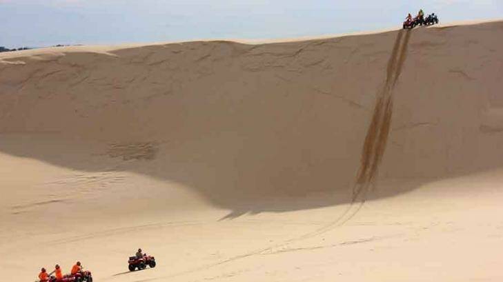 The quads bikes have 400cc engines, enough grunt to climb hills like this. Photo: Sand Dune Adventures
