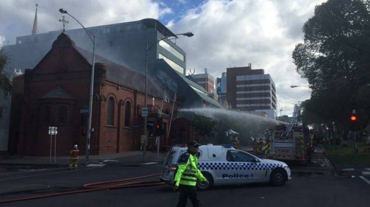 Firefighters bring the blaze under control. Photo: MFB