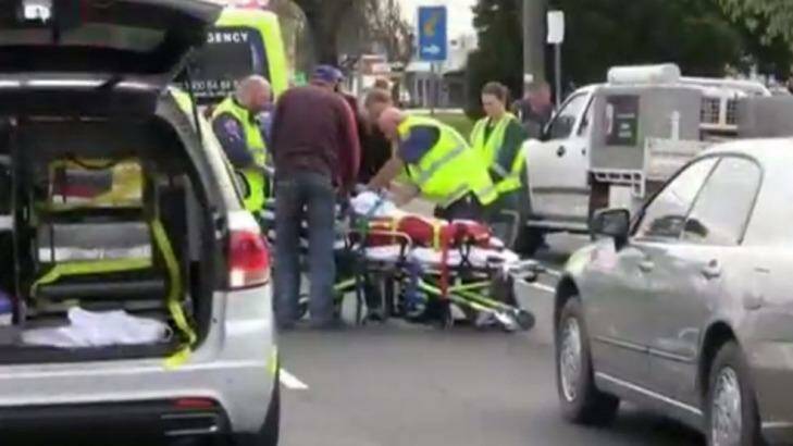 Paramedics attend to the injured boy in Main Street, Bairnsdale, on Saturday. Photo: Seven News