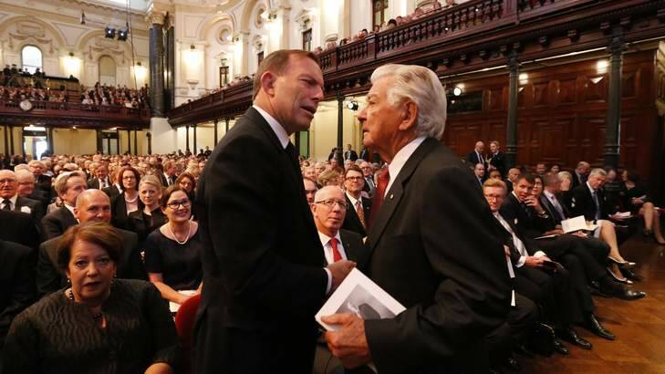 Prime Minister Tony Abbott shares a word with Bob Hawke before the Whitlam memorial service begins at Sydney's Town Hall. Photo: Peter Rae