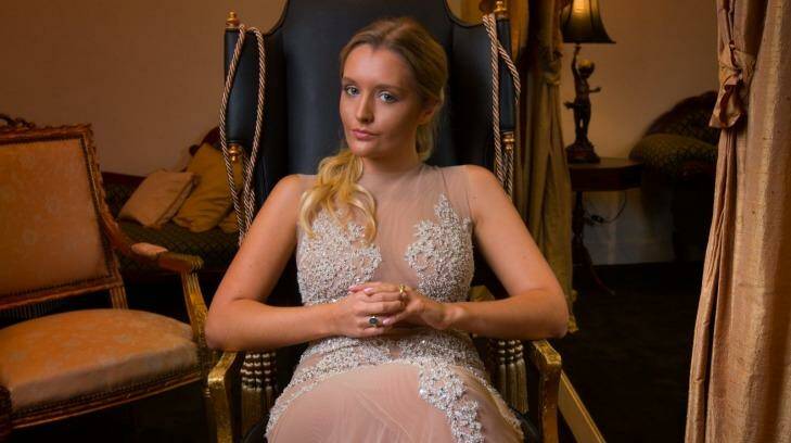 Zofia Krasicki tries on evening gowns at Oglia-Loro couture in South Yarra for le Bal in Paris. Photo: Simon Schluter