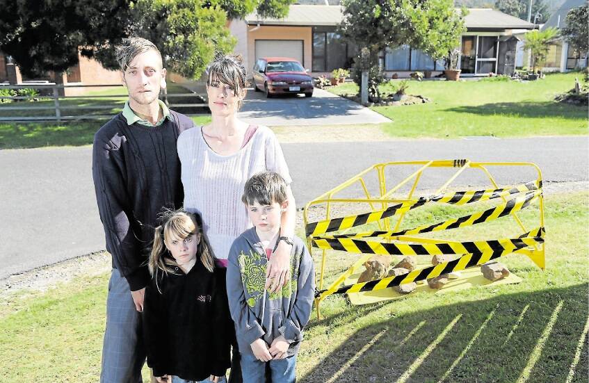 CAUSE FOR CONCERN: Still horrified by the potential discovery of asbestos in a Telstra pit across the road from their house in Sisters Beach are Jarrod Woodland and Melanie Strempel with Angela, 5, and Levi Strempel, 7. Picture: Meg Windram.