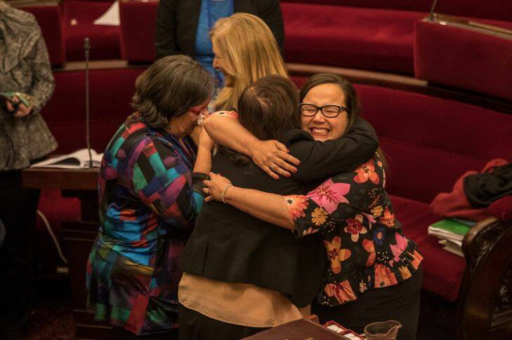 Members of the Victorian Upper house celebrate with hugs and tears of joy after a marathon 29 hours sitting to pass the Voluntary Assisted Dying Bill. Harriet Singh gets a huge hug from Nina Springle after the bill passes. 22nd November 2017. Photo by Jason South