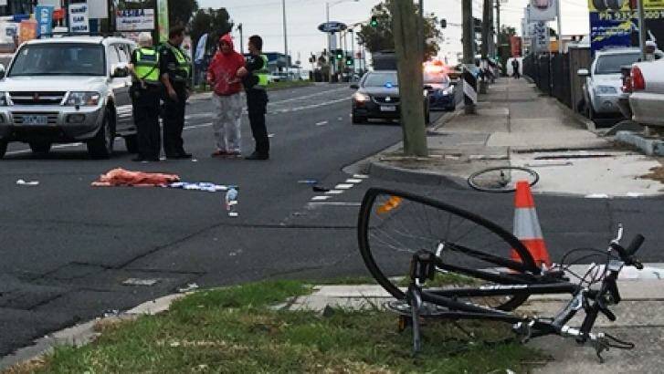 Police at the scene after a cyclist was hit on Sydney Road, Coburg. Photo: Tom McKendrick