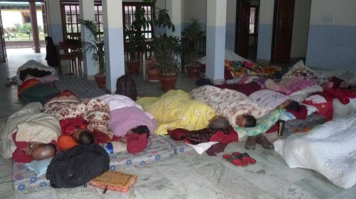 Members of the International Buddhist Academy sleep together after rooms were destroyed by the Nepal earthquakes. Photo: Pamela Steele Sherpa