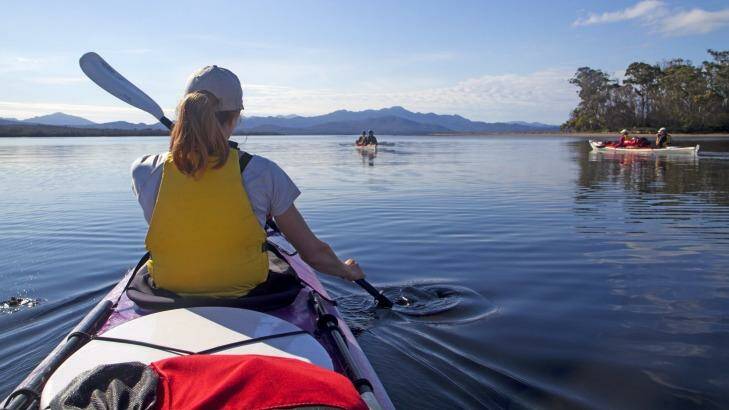 Still waters: Kayakers in Port Davey. Photo: Andrew Bain