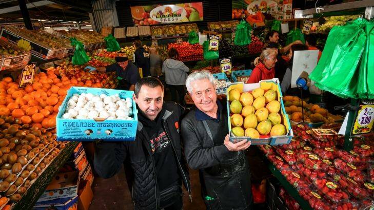 Danny Luppino, with son Dominic, has been a fruit and vegetable stallholder at Dandenong Market for 54 years.  Photo: Eddie Jim