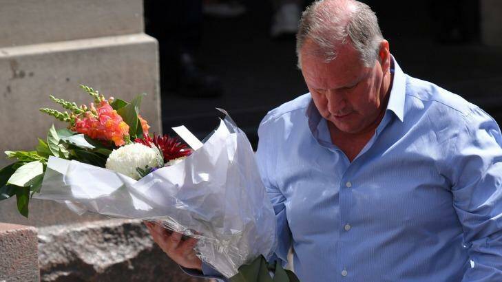 Lord mayor Robert Doyle lays flowers in the Bourke Street Mall. Photo: Eddie Jim
