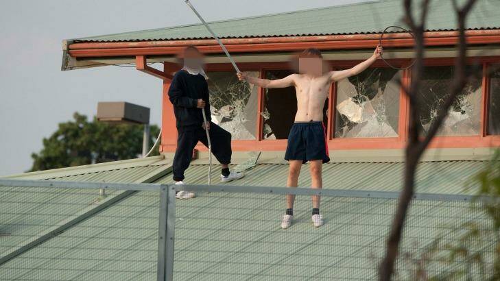 Youths protesting on the roof of the Melbourne Youth Justice Centre at Parkville in March. Photo: Jesse Marlow