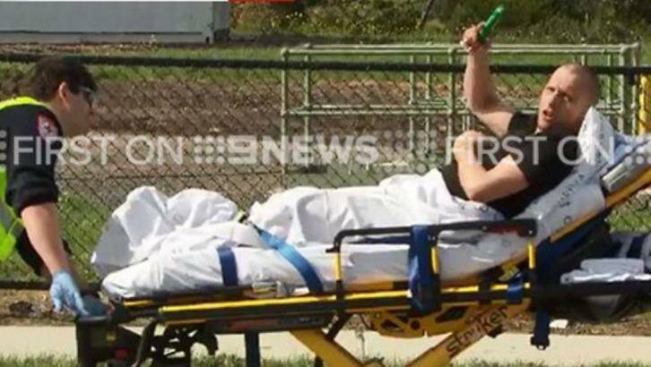 A man is transported in a stretcher after a crash in Epping on Sunday morning. Photo: Twitter @9NewsMelb