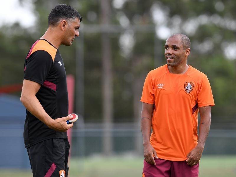 Henrique (R) is back in A-League training with Brisbane but it is not clear when he'll be unleashed.