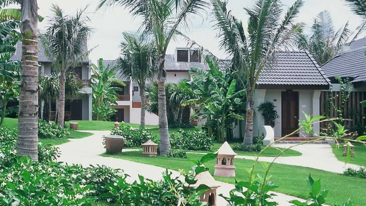 Tropical treasure: Bungalows in the lush gardens of the resort.