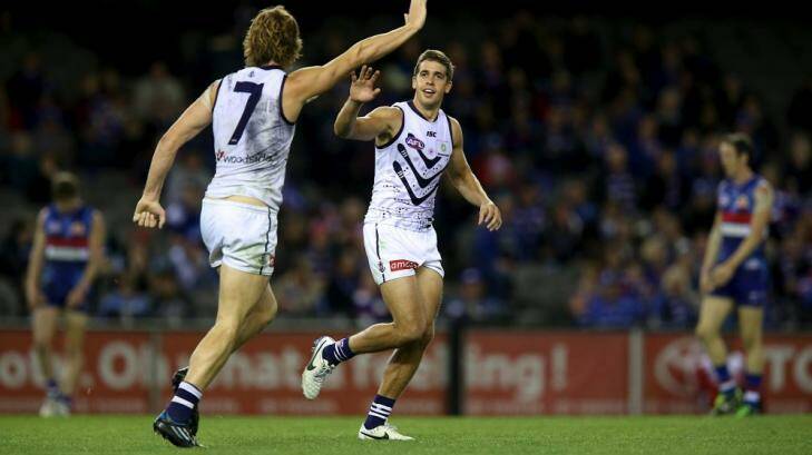 Nat Fyfe celebrates a goal with Stephen Hill, who should return for the clash with Carlton. Photo: Pat Scala