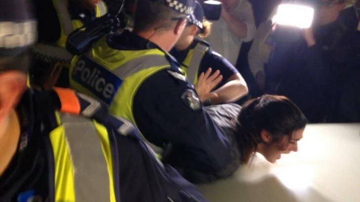 Police arrest a protester. Photo: Andy Hazel/unipollwatch