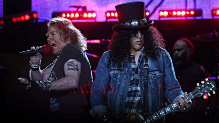 Guns N' Roses singer Axl Rose (left) and guitarist Slash perform at the MCG on Tuesday night. Photo: Paul Rovere