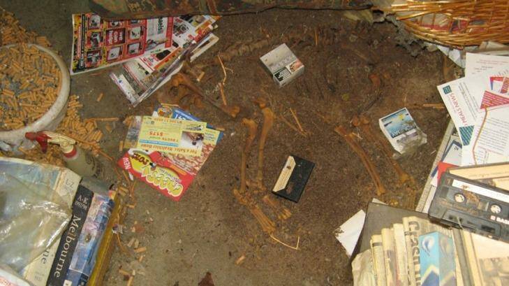 Hospital workers visiting the home of a 79-year-old woman from the Caulfield area found the skeleton of a dead dog, rooms piled with rubbish and discarded cigarettes. Photo: Supplied