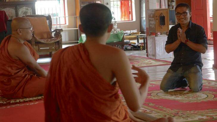 Gambira, right, at a temple in Chiang Mai, last year. The former monk was a volunteer teacher at the local temple, providing lessons to migrant workers and their families.
 Photo: Steve Sandford