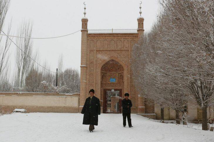 The Age- Uighurs in Xinjiang, China. Uyghur men walking out of a mosque in a village in Ujme township, Akto County. Photo by Sanghee Liu Filed 20th Feb 2014