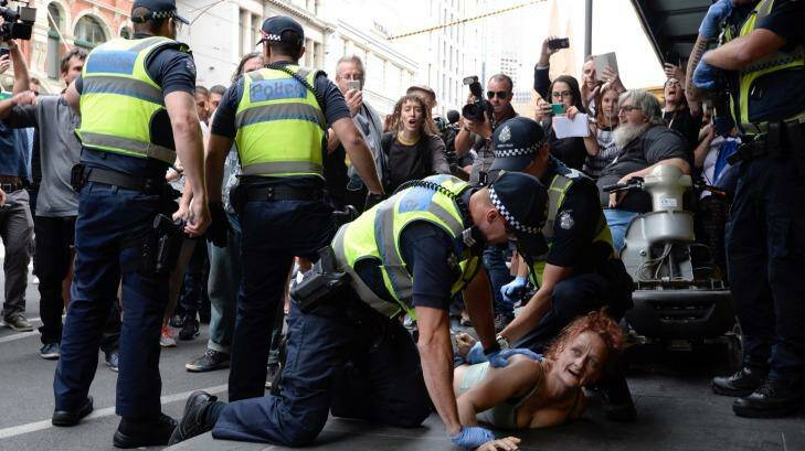 Police arrest one homeless woman at the scene of the protest. Photo: Penny Stephens