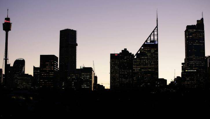 The Sydney CBD skyline at dusk. Office vacancy levels are falling, helped by the conversion of office towers into apartments. Photo:  Jessica Hromas