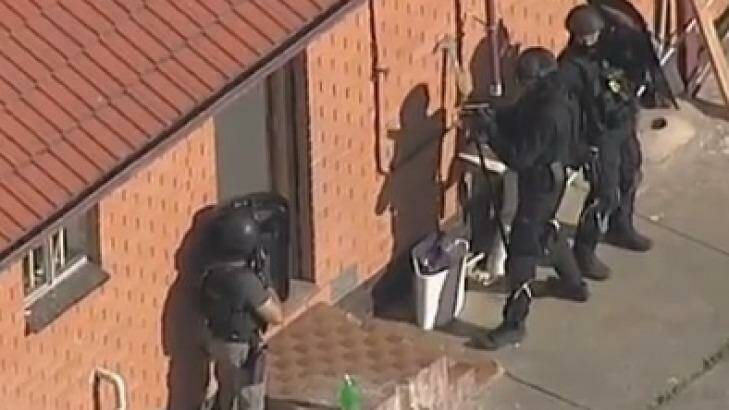 Police stormed the St Albans building after 10am. Photo: Courtesy Channel Seven