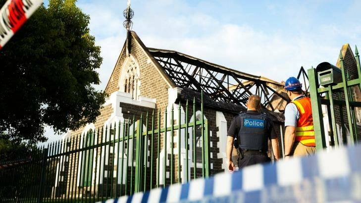 Emergency services workers inspect the wreckage of the mosque. Photo: Chris Hopkins