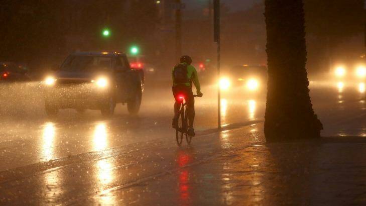 A cyclist braves the severe weather last week. Photo: Pat Scala