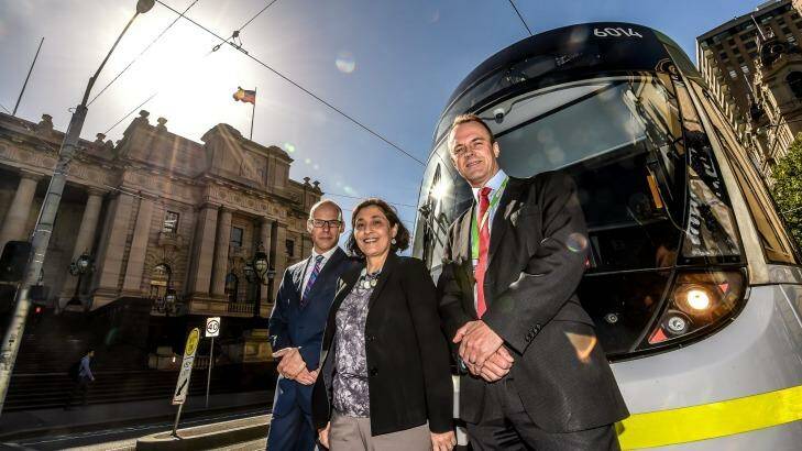 Energy Minister Lily D'Ambrosio with PTV chief executive Jeroen Weimar  (right) and Yarra Trams executive director Rob Robson. Photo: Justin McManus