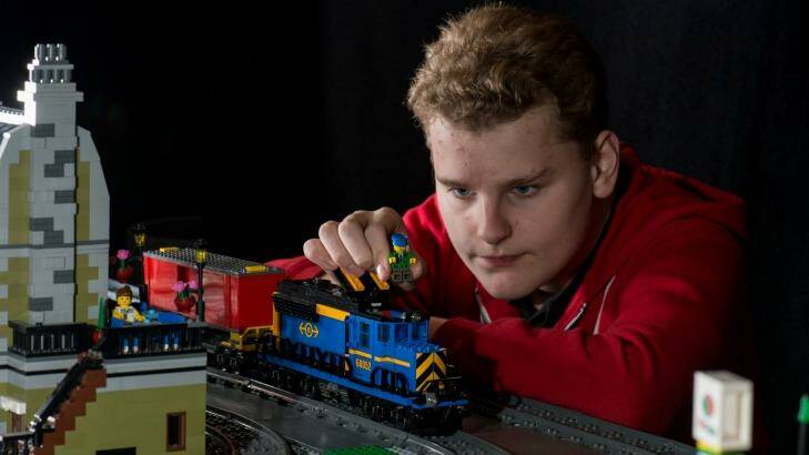 At 14 years old Justin Boyd already has his dream job. He's building the train track with various buildings at Inside the Brick's Interactive Play and Lego Fan Expo, to be held at the the Meat Market. Photo: Penny Stephens