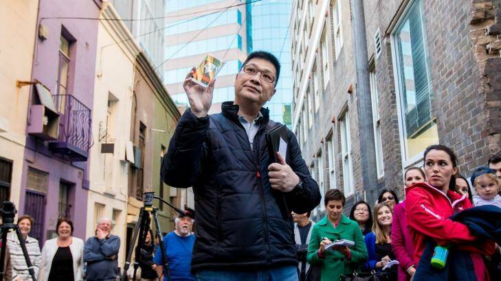 The winning bidder was buyer's agent Raymond Hung who was on the phone with a client in China. Photo: Cole Bennetts