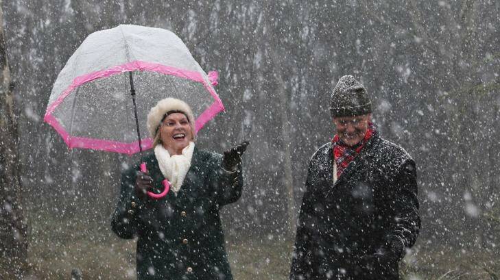Gloria and Bill Reeves enjoy the snow falling at Mt Macedon. Photo: Paul Rovere