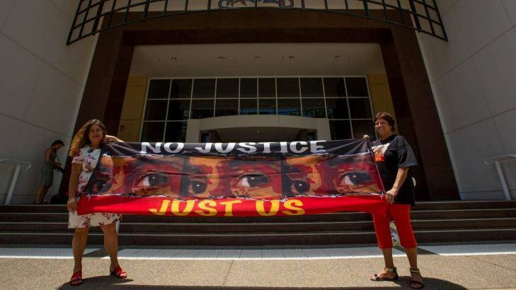 Protesters Theresa Rowe (left) and Josephine Crawshaw outside the royal commission in Darwin.  Photo: Glenn Campbell