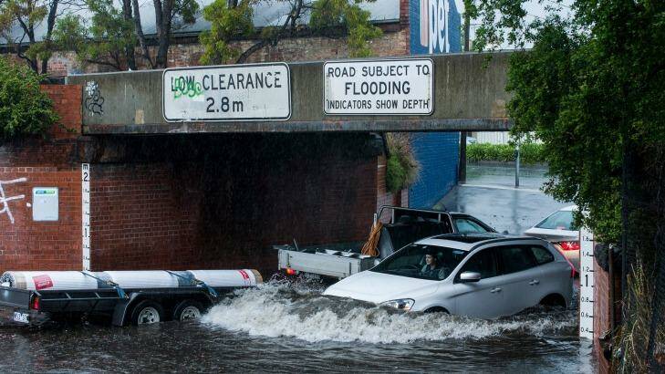 Flooding at a light rail underpass in South Melbourne. Photo: Paul Jeffers