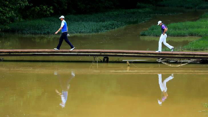 On reflection:  Rory McIlroy of Northern Ireland and Bernd Wiesberger of Austria cross the bridge on the sixth hole during the final round of the 96th PGA Championship at Valhalla. Photo: Getty Images