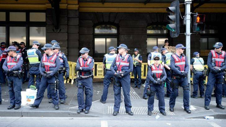 Police on Flinders Street on Wednesday afternoon. Photo: Penny Stephens